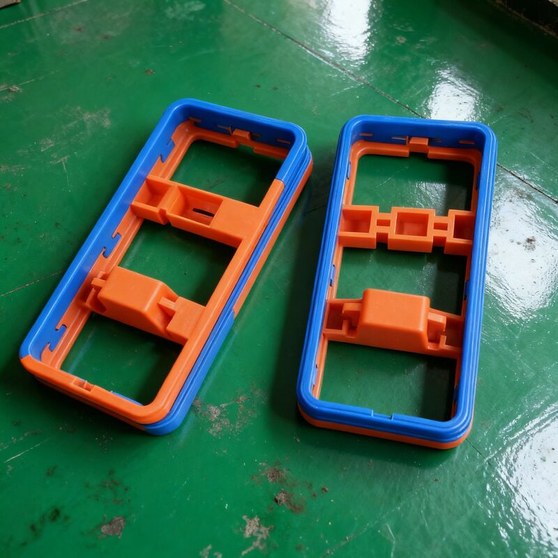 Custom Double Color 2K Injection Molding Parts OEM Plastic Overmolding Frame Housing Manufacturer